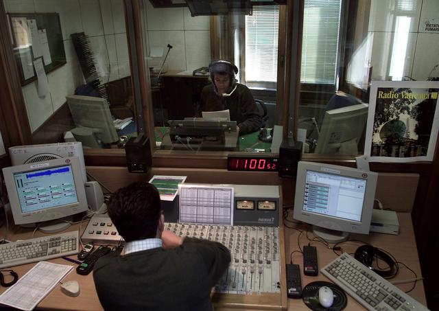 FILE PHOTO: A Vatican Radio reporter speaks during a live programme on April 10, 2001./File Photo