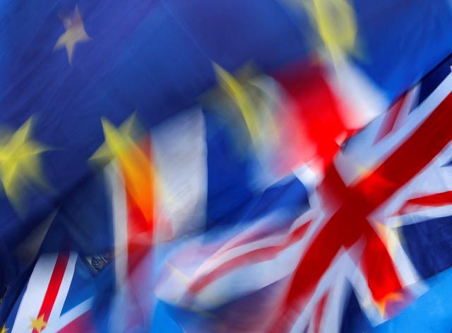FILE PHOTO: British and EU flags flutter outside the Houses of Parliament in London, Britain, January 15, 2019. REUTERS/Eddie Keogh