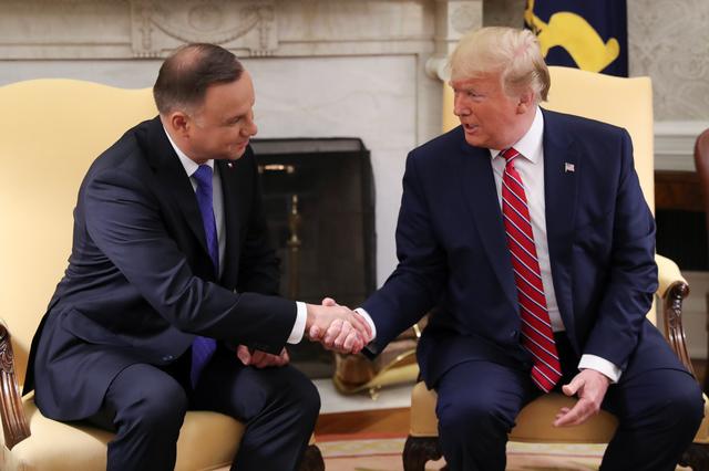 U.S. President Donald Trump greets Poland's President Andrzej Duda in the Oval Office of the White House in Washington, U.S., June 12, 2019. REUTERS/Leah Millis
