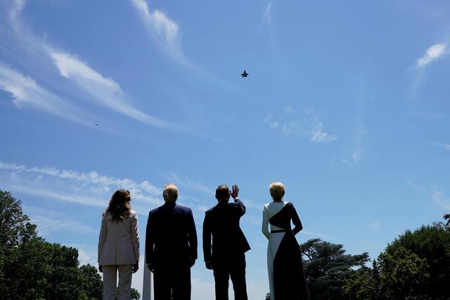 U.S. President Donald Trump and first lady Melania Trump stand with Poland's President Andrzej Duda and his wife, Agata Kornhauser-Duda, as they watch an F-35 flyover outside the White House in Washington, U.S., June 12, 2019. REUTERS/Kevin Lamarque