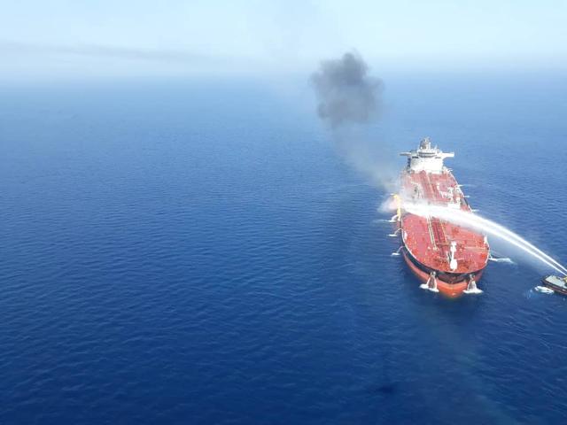 An Iranian navy boat tries to stop the fire of an oil tanker after it was attacked in the Gulf of Oman, June 13, 2019. Tasnim News Agency/Handout via REUTERS 