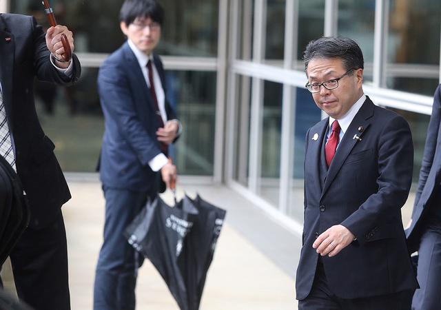 FILE PHOTO - Japan's Minister of Economy, Trade and Industry Hiroshige Seko leaves the European Commission headquarters after a meeting on steel overcapacity, in Brussels, Belgium March 10, 2018. REUTERS/Francois Walschaerts