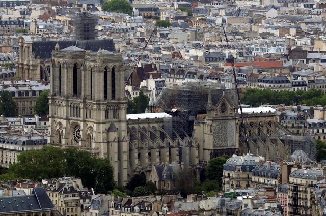 FILE PHOTO: A view shows Notre-Dame Cathedral after a massive fire devastated large parts of the gothic structure in Paris, France, May 10, 2019. REUTERS/Gonzalo Fuentes