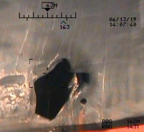 A U.S. military image released by the Pentagon in Washington on June 17, which is says was taken from a U.S. Navy MH-60R helicopter in the Gulf of Oman in waters between Gulf Arab states and Iran on June 13, shows mine blast damage to M/T Kokuka Courageous, a Japanese owned commercial motor tanker. Picture taken June 13, 2019.  U.S. Navy/Handout via REUTERS 