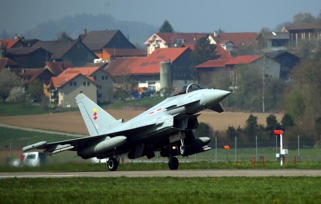 FILE PHOTO: A Eurofighter Typhoon jet lands after tests organised by Armasuisse to replace the fighter jets of the Swiss Air Force in Payerne, Switzerland April 12, 2019. REUTERS/Denis Balibouse/File Photo