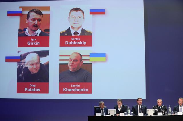Russian nationals Igor Girkin, Sergey Dubinskiy and Oleg Pulatov, as well as Ukrainian Leonid Kharchenko, accused of downing of flight MH17, are shown on screen as international investigators present their latest findings in the downing of Malaysia Airlines flight MH17, nearly five years after the crash that killed 298 passengers and crew, in Nieuwegein, Netherlands, June 19, 2019.  REUTERS/Eva Plevier      