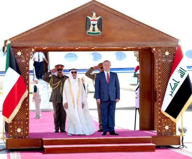 Iraq's President Barham Salih stands with Kuwait's ruling emir Sheikh Sabah al-Ahmad al-Sabah during a welcoming ceremony in Baghdad, Iraq, June 19, 2019. The Presidency of the Republic of Iraq Office/Handout via REUTERS 