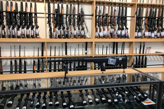 FILE PHOTO: FILE PHOTO: Firearms and accessories are displayed at Gun City gunshop in Christchurch, New Zealand, March 19, 2019. REUTERS/Jorge Silva/Files/File Photo