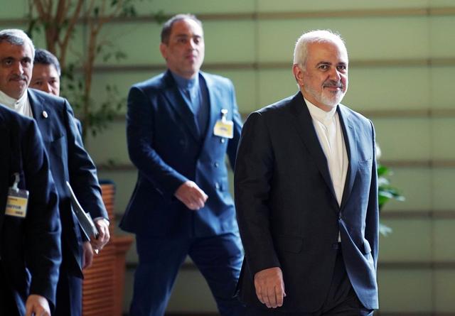 Iranian Foreign Minister Mohammad Javad Zarif, right, walks to meet Japanese Prime Minister Shinzo Abe at Abe's official residence in Tokyo Thursday, May 16, 2019.  Eugene Hoshiko/Pool via REUTERS