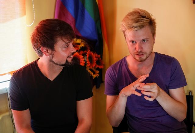 Gay married couple Roman Ivasiy, a 27-year-old doctor and Anton Pozdnyakov, a 32-year-old event manager, is seen in their flat in Kiev, Ukraine June 19, 2019. Picture taken June 19, 2019.   REUTERS/Gleb Garanich
