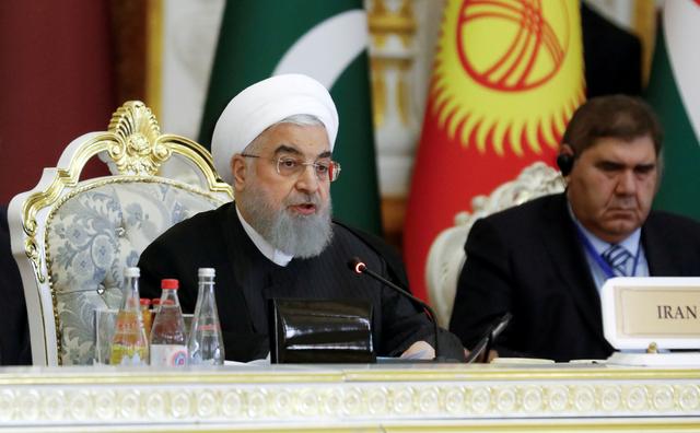 FILE PHOTO: Iranian President Hassan Rouhani delivers a speech at the Conference on Interaction and Confidence-Building Measures in Asia (CICA) in Dushanbe, Tajikistan June 15, 2019. REUTERS/Mukhtar Kholdorbekov/File Photo