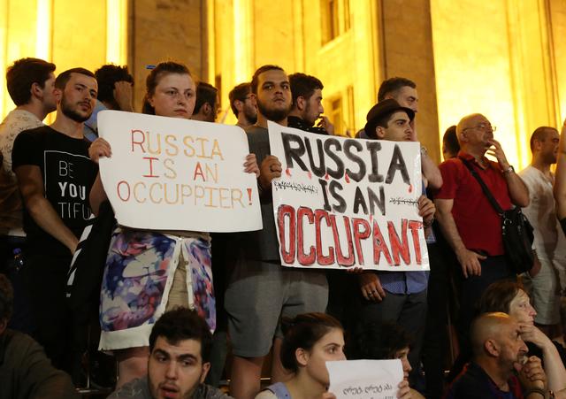 Protesters attend a rally against a Russian lawmaker's visit near the parliament building in Tbilisi, Georgia June 22, 2019. REUTERS/Irakli Gedenidze