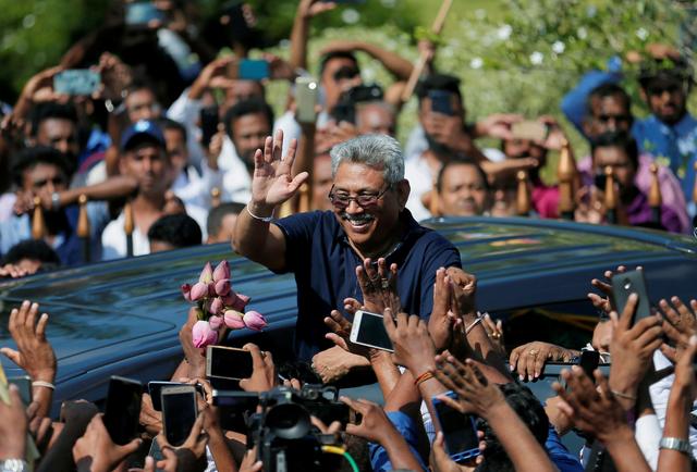 FILE PHOTO: Sri Lanka's former defense secretary Gotabaya Rajapaksa greets supporters after his return from the United States, in Katunayake, Sri Lanka April 12, 2019. REUTERS/Dinuka Liyanawatte/File Photo