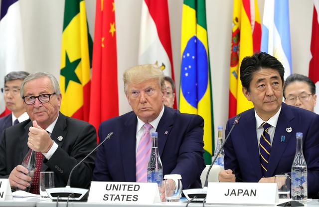(R-L) Japan's Prime Minister Shinzo Abe, U.S. President Donald Trump and European Commission President Jean-Claude Juncker attend the G20 summit in Osaka, Japan June 28, 2019. Sputnik/Mikhail Klimentyev/Kremlin via REUTERS  