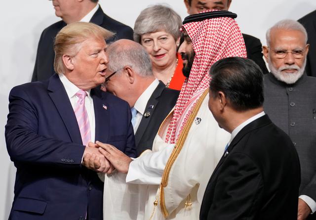Saudi Arabia's Crown Prince Mohammed bin Salman shakes hands with U.S. President Donald Trump , as China's President Xi Jinping, Britain's Prime Minister Theresa May and India's Prime Minister Narendra Modi look on during a family photo session at the G20 leaders summit in Osaka, Japan, June 28, 2019.  REUTERS/Kevin Lamarque