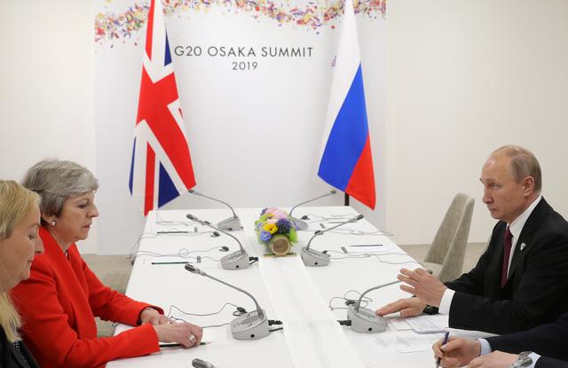 Russia's President Vladimir Putin and Britain's Prime Minister Theresa May attend a meeting on the sidelines of the G20 summit in Osaka, Japan June 28, 2019. Sputnik/Mikhail Klimentyev/Kremlin via REUTERS  ATTENTION EDITORS - THIS IMAGE WAS PROVIDED BY A THIRD PARTY.