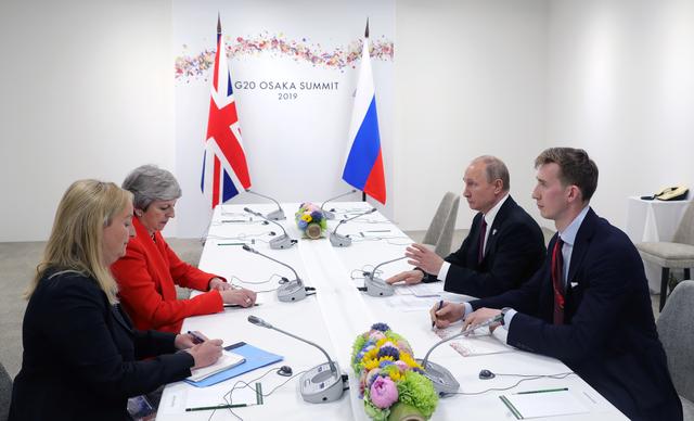 Russia's President Vladimir Putin (2nd R) and Britain's Prime Minister Theresa May (2nd L) attend a meeting on the sidelines of the G20 summit in Osaka, Japan June 28, 2019. Sputnik/Mikhail Klimentyev/Kremlin via REUTERS 