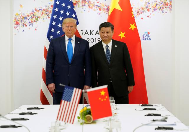 U.S. President Donald Trump poses for a photo with China's President Xi Jinping before their bilateral meeting during the G20 leaders summit in Osaka, Japan, June 29, 2019. REUTERS/Kevin Lamarque