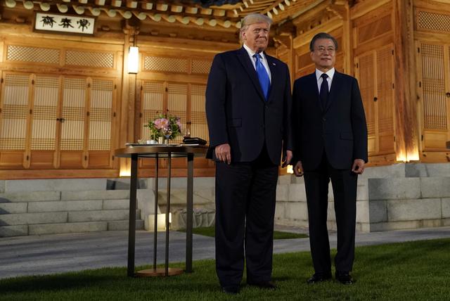 South Korea's President Moon Jae-in and U.S. President Donald Trump pose for a picture before a dinner at the Presidential Blue House in Seoul, South Korea, June 29, 2019. REUTERS/Kevin Lamarque