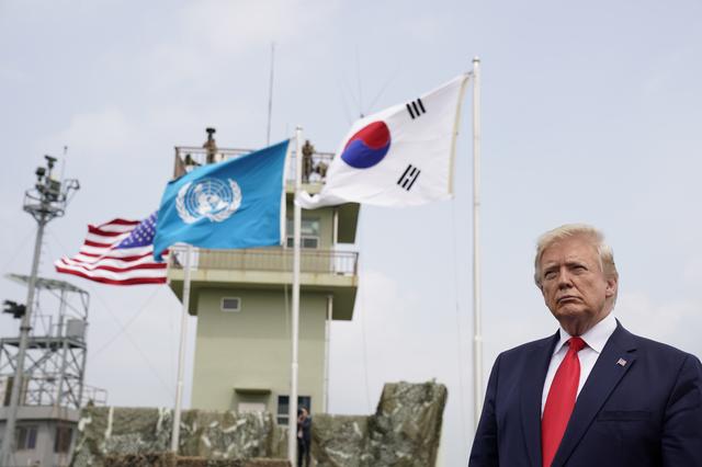 U.S. President Donald Trump looks on during a visit at the demilitarized zone separating the two Koreas, in Panmunjom, South Korea, June 30, 2019. REUTERS/Kevin Lamarque