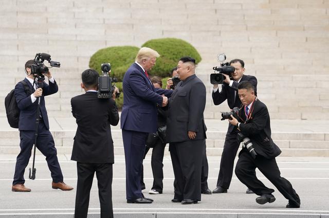 U.S. President Donald Trump meets with North Korean leader Kim Jong Un at the demilitarized zone separating the two Koreas, in Panmunjom, South Korea, June 30, 2019. REUTERS/Kevin Lamarque