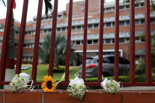 Flowers are laid to honor Rafael Acosta, a navy captain who died while in detention according to his wife, outside the building of Navy's General Command in Caracas, Venezuela July 1, 2019. REUTERS/Manaure Quintero NO RESALES. NO ARCHIVES.