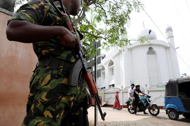 FILE PHOTO: A soldier stands guard outside the Grand Mosque, days after a string of suicide bomb attacks on churches and luxury hotels across the island on Easter Sunday, in Negombo, Sri Lanka April 26, 2019, -
