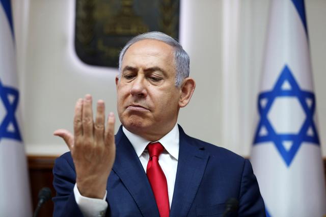 FILE PHOTO: Israeli Prime Minister Benjamin Netanyahu gestures during the weekly cabinet meeting at his office in Jerusalem July 7, 2019. Abir Sultan/Pool via REUTERS/File Photo