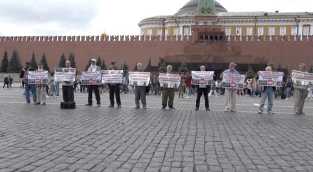 FILE PHOTO: A still image taken from a video footage and obtained by Reuters on July 10, 2019, shows Crimean Tatars during a demonstration to draw attention to alleged rights abuses in Crimea, in Red Square in Moscow, Russia. TVRAIN.RU/Handout via REUTERS TV  