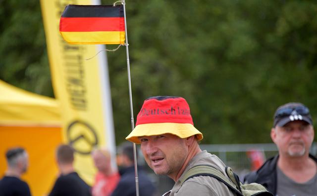 FILE PHOTO: Members of the far-right Identitarian Movement hold a rally in Dresden, Germany August 25, 2018. Reuters/Matthias Rietschel