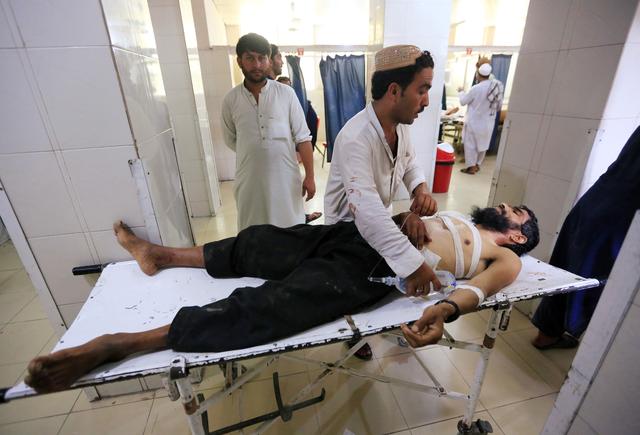 An injured man receives treatment at the hospital, after a suicide attack in Jalalabad, Afghanistan July 12, 2019. REUTERS/Parwiz
