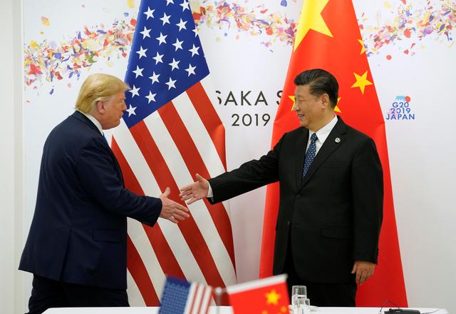 FILE PHOTO: U.S. President Donald Trump and China's President Xi Jinping shake hands before their bilateral meeting during the G20 leaders summit in Osaka, Japan, June 29, 2019. REUTERS/Kevin Lamarque/File Photo