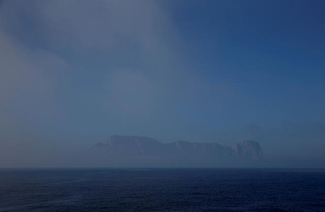 FILE PHOTO: Fog around the Rock of the British overseas territory of Gibraltar is seen from a ship off Gibraltar December 6, 2018.  REUTERS/Darrin Zammit Lupi