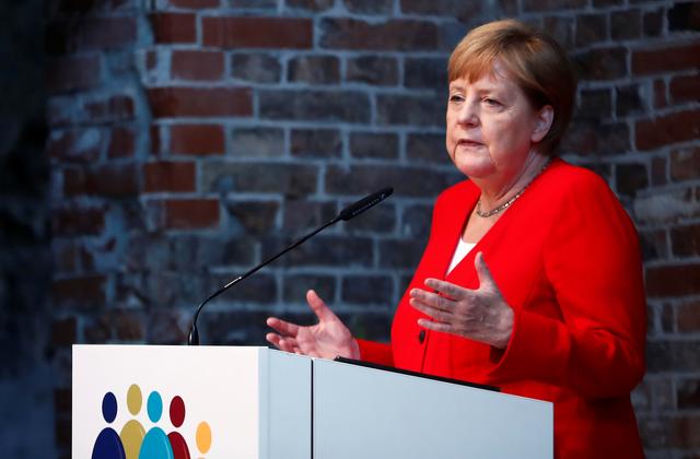 FILE PHOTO: German Chancellor Angela Merkel speaks during a ceremony to mark 50 years of German development aid in Berlin, Germany, July 12, 2019. REUTERS/Hannibal Hanschke