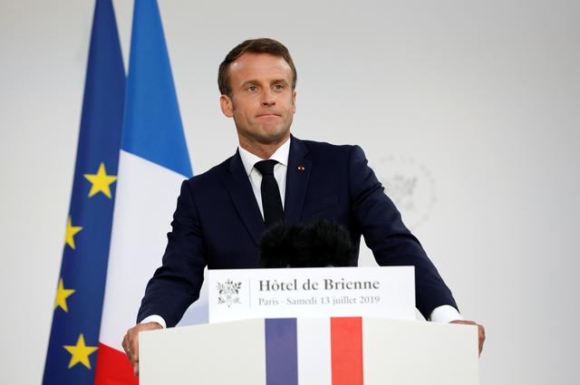 French President Emmanuel Macron speaks at the residence of French Defense Minister on the eve of Bastille Day in Paris, France, July 13, 2019. Kamil Zihnioglu/Pool via REUTERS