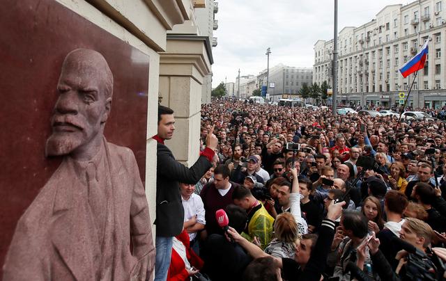Russian opposition figure Ilya Yashin addresses his supporters, next to a bas-relief of Soviet state founder Vladimir Lenin, at a rally to protest against alleged violations ahead of elections to Moscow City Duma, the capital's regional parliament, in Moscow, Russia July 14, 2019. REUTERS/Maxim Shemetov