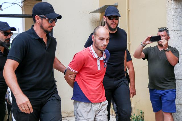 Plain-clothes police officers escort the suspect (C) for the murder of American biologist Suzanne Eaton to the prosecutor in Chania, on the island of Crete, Greece, July 16, 2019. REUTERS/Makis Kartsonakis 