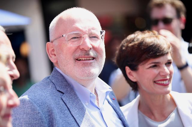 FILE PHOTO: European Commission deputy president Frans Timmermans (L) and Austrian Social Democratic (SPO) leader Pamela Rendi-Wagner campaign ahead of the European Parliament elections in Vienna, Austria, May 25, 2019. REUTERS/Lisi Niesner