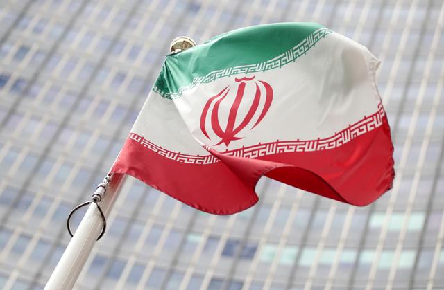 FILE PHOTO - The Iranian flag flutters in front the International Atomic Energy Agency (IAEA) headquarters in Vienna, Austria July 10, 2019.  REUTERS/Lisi Niesner