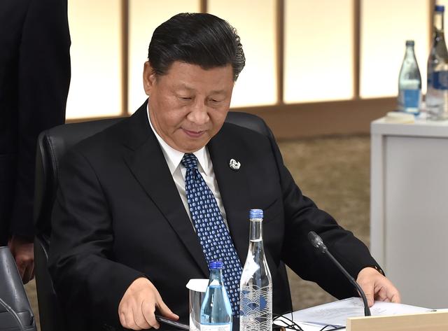 FILE PHOTO - Chinese President Xi Jinping attends the session 3 on women's workforce participation, future of work, and ageing societies at the G20 Summit in Osaka on June 29, 2019. Kazuhiro Nogi/Pool via REUTERS