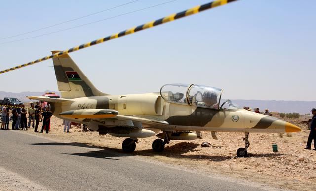 A warplane belonging to eastern Libyan forces fighting the internationally recognized Tripoli government is seen after an emergency landing on a road in the southern Tunisian town of Beni Khadash, July 22, 2019. REUTERS/Stringer