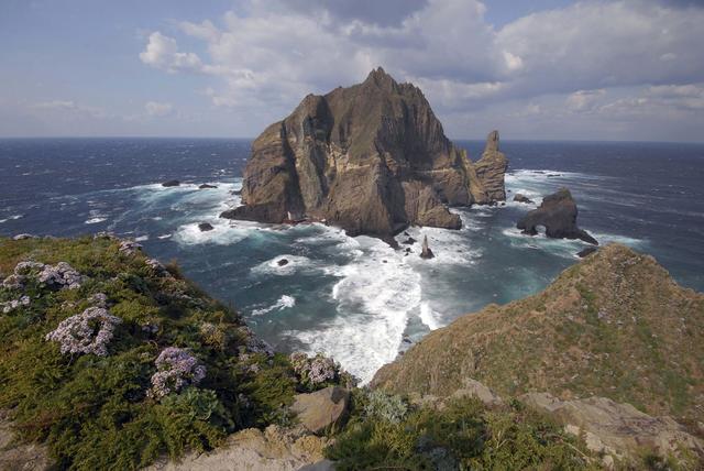 FILE PHOTO: A general view shows a part of the group of islets known in South Korea as Dokdo and in Japan as Takeshima in the Sea of Japan October 20, 2007. REUTERS/Yuri Maltsev/File Photo