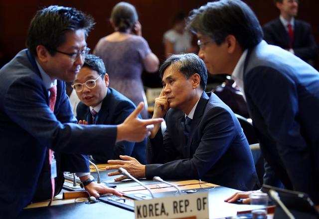Sout Korea deputy trade minister Kim Seung-ho (C) attends the General Council meeting where the worsening trade and diplomatic dispute between South Korea and Japan will be raised at the World Trade Organization (WTO) in Geneva, Switzerland, July 24, 2019. REUTERS/Denis Balibouse