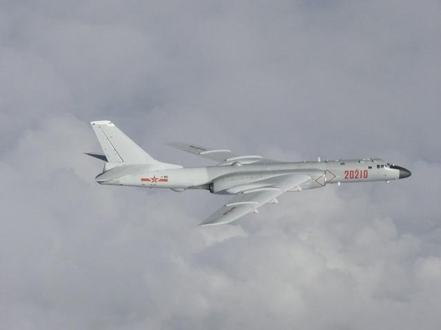 FILE PHOTO: A Chinese H-6 bomber flies over East China Sea in this handout picture taken by Japan Air Self-Defence Force and released by the Joint Staff Office of the Defense Ministry of Japan July 23, 2019. Joint Staff Office of the Defense Ministry of Japan/HANDOUT via REUTERS/File Photo