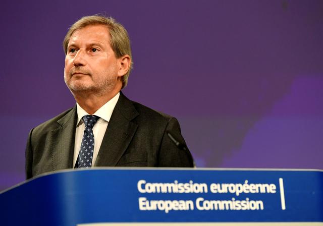 FILE PHOTO: European Neighbourhood Policy and Enlargement Negotiations Commissioner Johannes Hahn presents the Commission's Enlargement Package for 2019, which sets out the way forward for candidate countries and takes stock of the situation in each candidate country and potential candidate, in Brussels, Belgium May 29, 2019. REUTERS/Piroschka van de Wouw