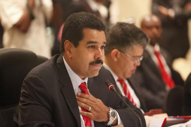 FILE PHOTO: Venezuelan President Nicholas Maduro addresses members of CARICOM at a plenary session during the 40th Heads of government meeting at the Hilton Trinidad and Conference Centre July 6, 2013. REUTERS/Andrea De Silva 