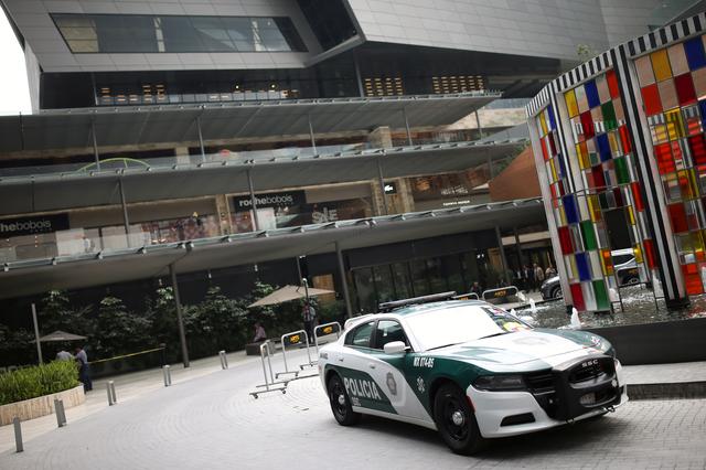 A police car is parked near a crime scene where two Israeli men were shot dead, at a shopping mall in Mexico City, Mexico July 25, 2019. REUTERS/Edgard Garrido