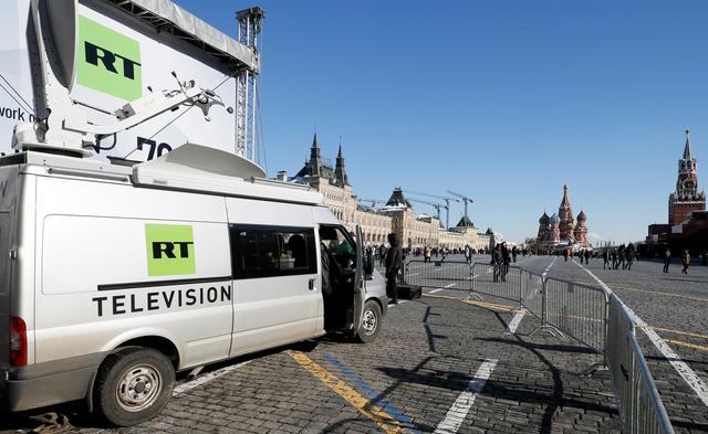 FILE PHOTO: Vehicles of Russian state-controlled broadcaster Russia Today (RT) are seen at Red Square in central Moscow, Russia March 18, 2018. REUTERS/Gleb Garanich/File Photo