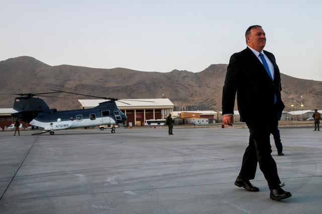 FILE PHOTO: Secretary of State Mike Pompeo walks from a helicopter to return to his plane at the end of an unannounced visit to Kabul, Afghanistan, June 25, 2019. Jacquelyn Martin/Pool via REUTERS