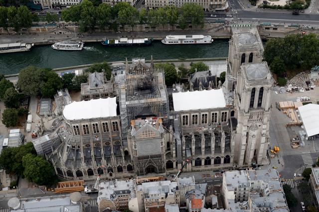 FILE PHOTO: A view shows the damaged roof of Notre-Dame de Paris during restoration work, three months after a fire that devastated the cathedral in Paris, France, July 14, 2019. REUTERS/Philippe Wojazer/File Photo